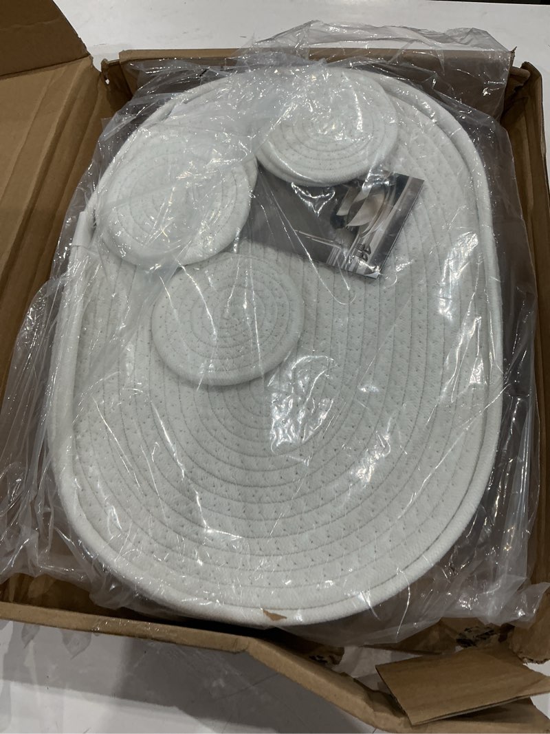 Condition photo showing As Is for art pinecone's woven cotton rope oval placemats set of 6, 16 * 12 inches. heat resistant and non-slip rope placemats - complete with holder and perfect for table decor! (plus coasters, off white)