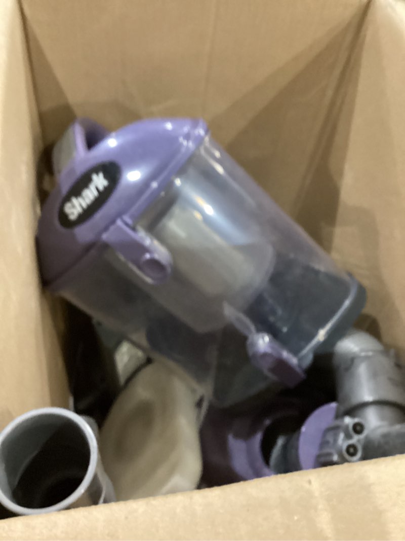 Condition photo showing As Is for shark nv352 navigator lift away upright vacuum, hepa filter, anti-allergen technology, swivel steering, ideal for carpet, stairs, & bare floors, with wide upholstery & crevice tools, lavender navigator (lavender)