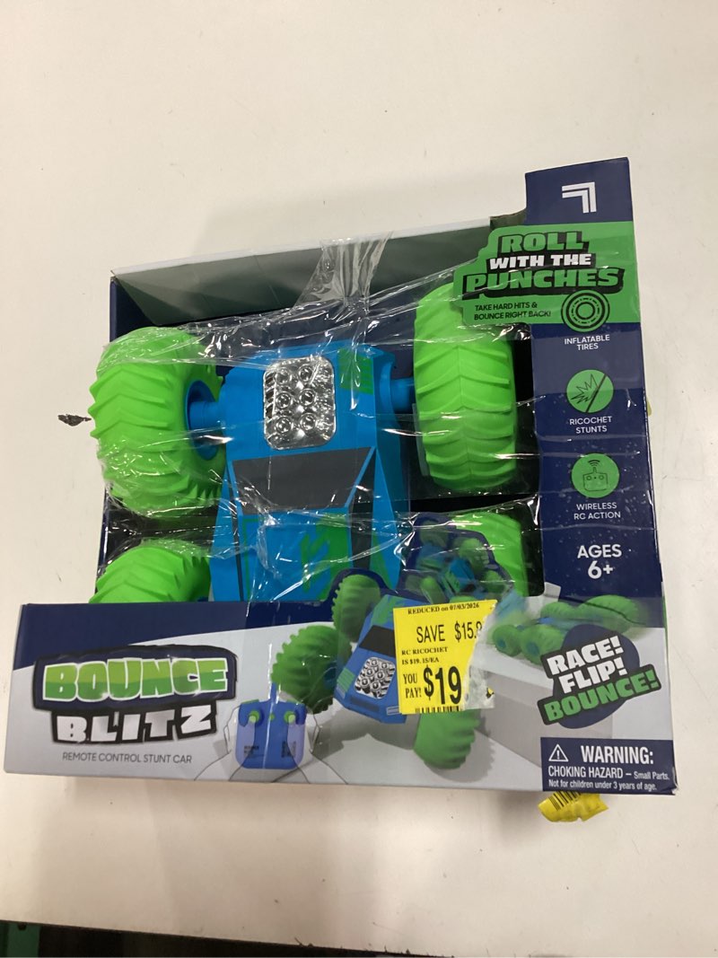 Condition photo showing As Is for the sharper image bounce blitz remote control stunt car in blue and green