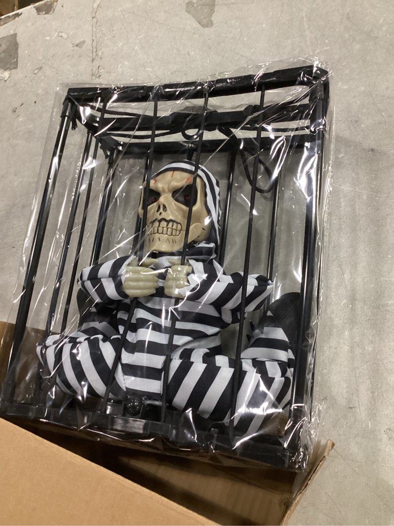 Condition photo showing New/Like New for screaming animated halloween decorations, halloween decor prop with motion sensor, scary skull cage prisoner haunted house decor, spooky hanging ghost halloween decorations outdoor indoor black ghost