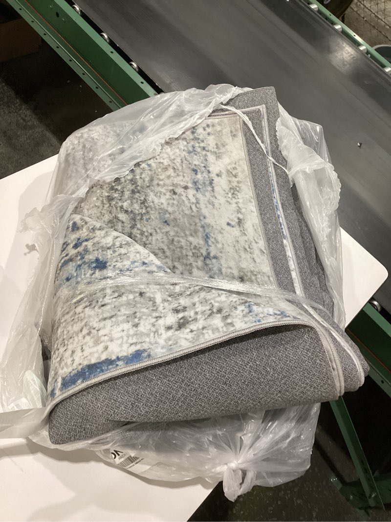 Condition photo showing Good Condition for Eleisa Modern Abstract 5x7 Area Rug for Living Room, Blue & Grey, Non-Slip Stain Resistant Washable Rug, Abstract Vintage Home Decor Carpet for Bedroom, Kitchen, Dining Room Blue/Grey (Rectangular), SIMILAR TO STOCK PHOTO, SIZE UNKNOWN