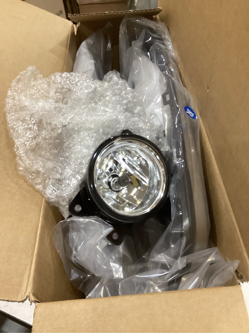 Condition photo showing New/Like New for passenger-side front bumper fog light bezel cover