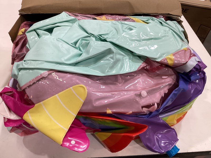 Condition photo showing As Is for unicorn world paly center inflatable water park - sun squad™