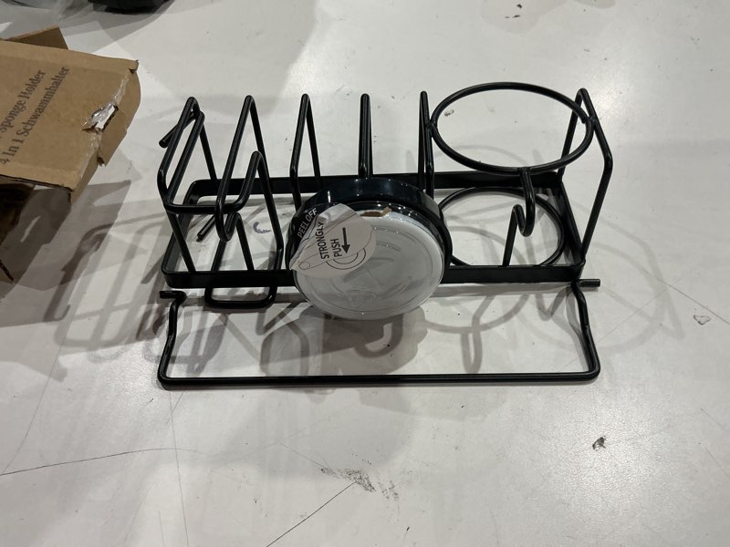 Condition photo showing As Is for taili 4-in-1 sink caddy with strong suction cup, sponge holder for kitchen sink organizer, removable, rustproof, stainless steel holder for sponge, brush, scrubber, scraper - black 7.28" x 2.36" black