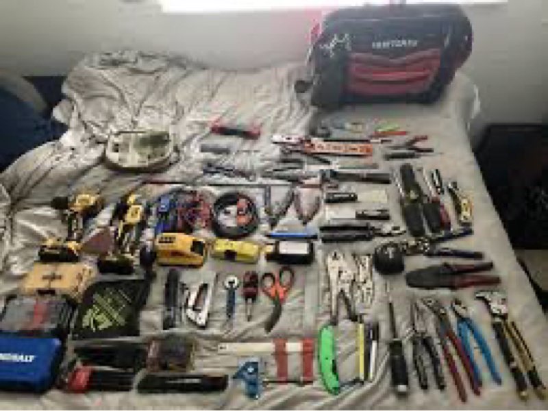 Mixture of small miscellaneous loose tools, screws, latches, home repair accessories