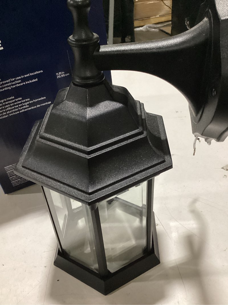 Condition photo showing As Is for project source henfield 1-light 11.81-in h matte black outdoor wall light