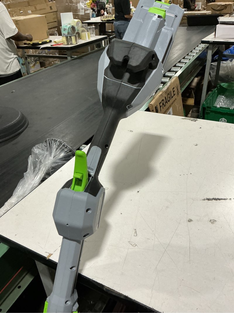 Condition photo showing As Is for ego power + powerload with line iq 56-volt 16-in telescopic shaft battery string trimmer 4.0 ah (battery included) (charger included)