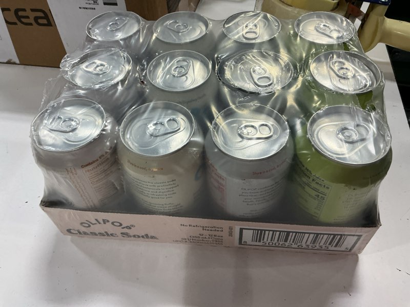 Condition photo showing New/Like New for OLIPOP Prebiotic Soda Pop, Classic Soda Variety, Pantry Pack Packed with Prebiotics, Fiber, and Botanicals, Gluten Free, Vegan, GMO Free, 12oz (12-Cans)( BB MAR 17/2027