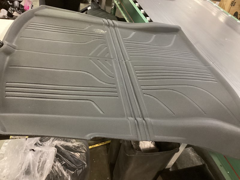 Condition photo showing As Is for Large floor mat for vehicle