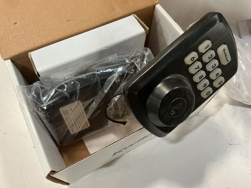 Condition photo showing As Is for kwikset powerbolt 250 10-button keypad venetian bronze transitional electronic deadbolt door lock, featuring convenient keyless entry, customizable user codes and auto-locking