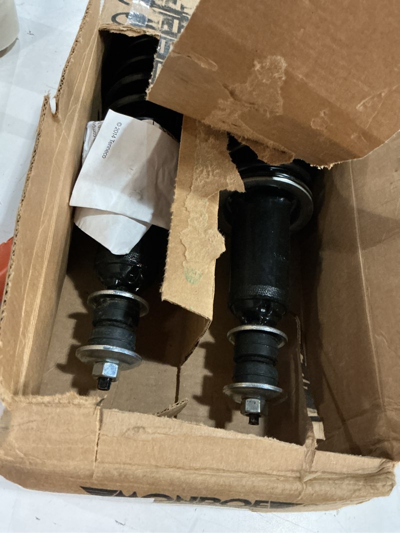 Condition photo showing As Is for monroe load adjusting 58551 suspension shock absorber and coil spring assembly pack of 2 for chevrolet camaro