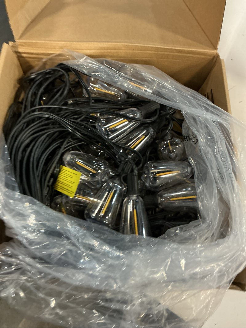 Condition photo showing Good Condition for Brightever LED Outdoor String Lights 100FT Patio Lights with 52 Shatterproof ST38 Vintage Edison Bulbs, Outside Hanging Light Waterproof for Porch, Deck, Garden, Backyard, Balcony, 2700K Dimmable Black Wire 100FT-Warm White