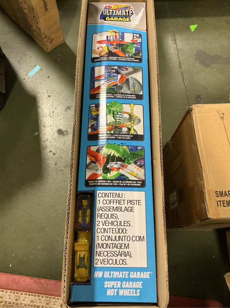 Condition photo showing Good Condition for Hot Wheels City Toy Car Track Set, Ultimate Garage with T-Rex Dinosaur, Store 100+ 1:64 Scale Vehicles, 3-ft Tall, with 2 Cars (Amazon Exclusive)