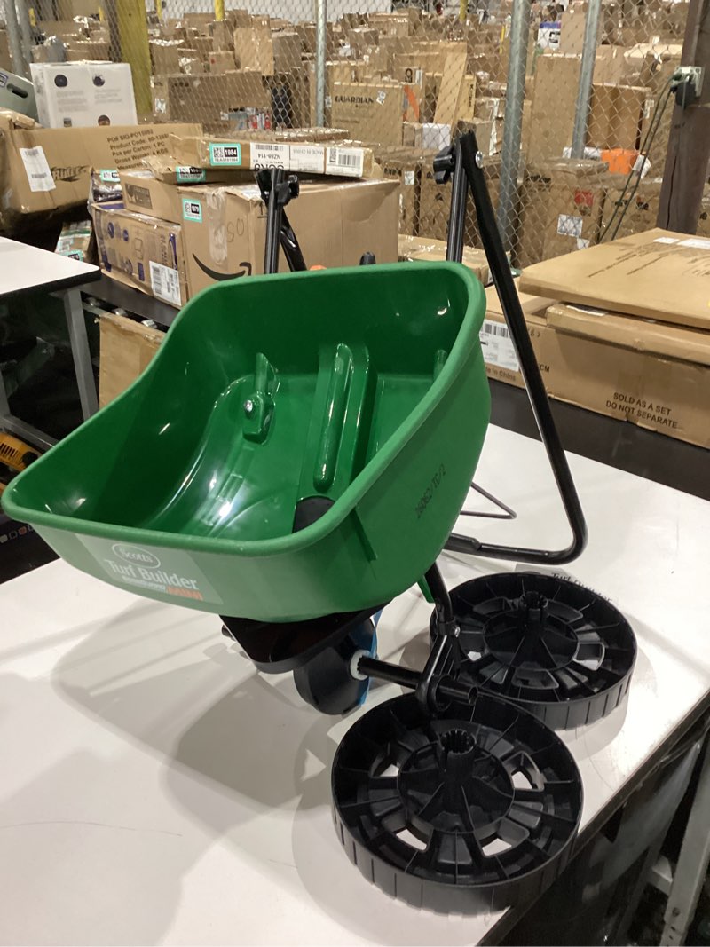 Condition photo showing New/Like New for scotts turf builder edgeguard mini broadcast spreader - spreads grass seed, fertilizer and salt - holds up to 5,000 sq. ft. of scotts grass seed or fertilizer products