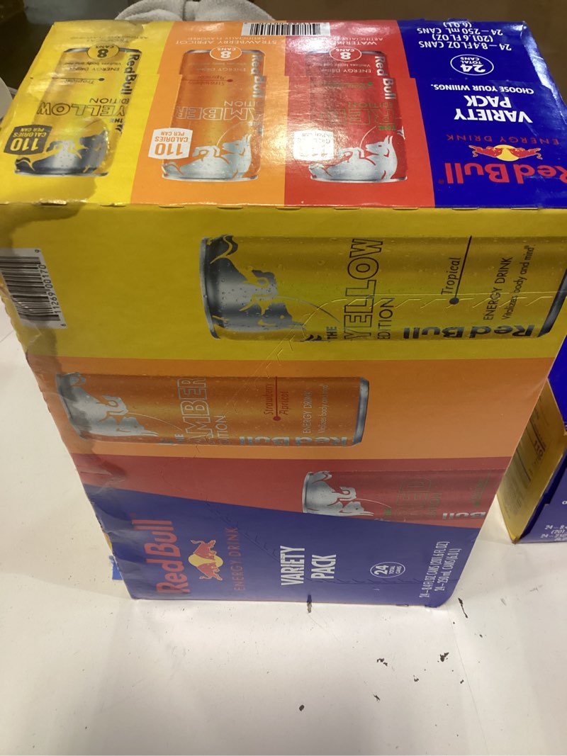 Condition photo showing As Is for bb 06/01/26red bull energy drink variety pack, red edition, amber edition and yellow edition energy drinks, 8.4 fl oz, 24 cans variety pack 8.4 fl oz, 24pk