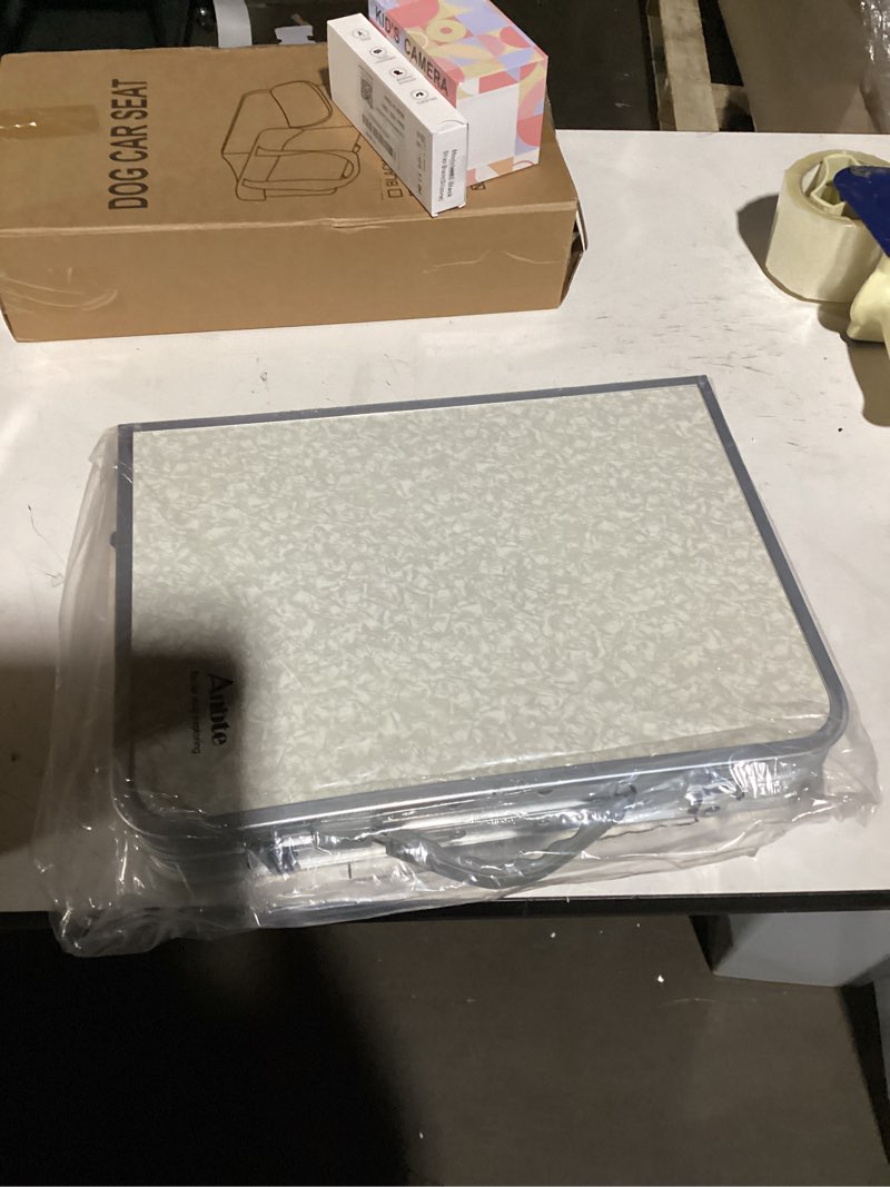 Condition photo showing item condition for Anbte Folding Camping Table, Aluminum 24" x 16" Adjustable Height Small Folding Table with Carrying Handle, Lightweight, Portable Camping Table Waterproof for Outdoor Indoor Picnic Beach BBQ, Silver