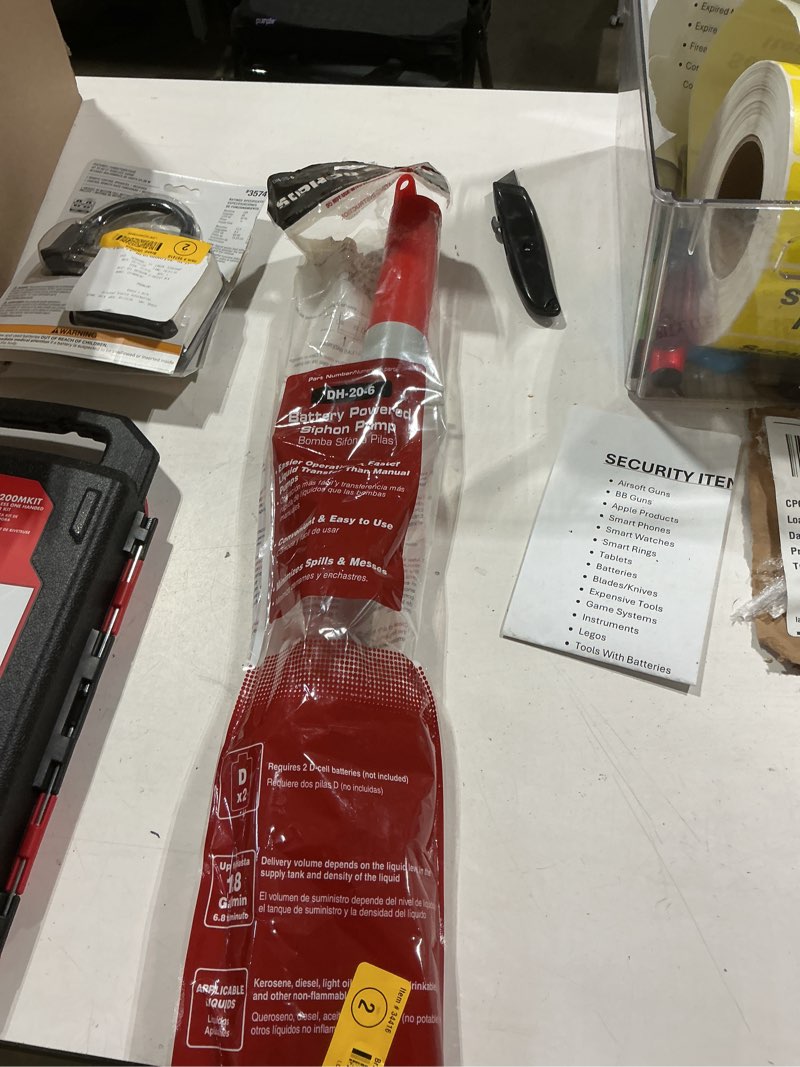 Condition photo showing As Is for dyna-glo battery operated plastic 22.5 in. siphon pump