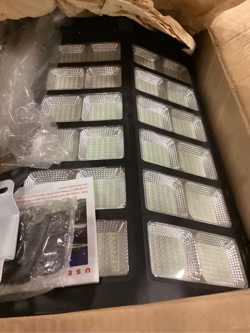 Condition photo showing Good Condition for INSDEA 5000W Solar Street Light Motion Sensor, 500000LM Solar Parking Lot Lights Dusk to Dawn, IP65 Waterproof Solar Security Flood Lights Outdoor, LED Solar Lights for Outside Garden Yard, Black