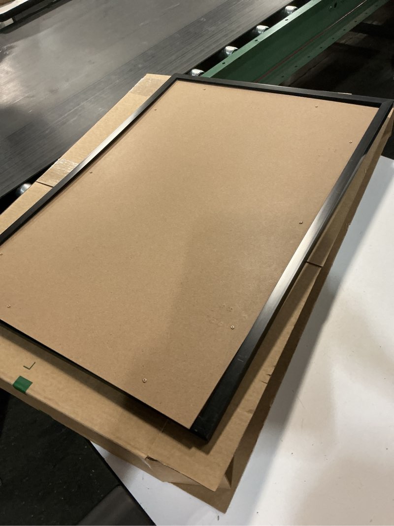 Condition photo showing As Is for MCS Studio Gallery 20x28 Poster Frame Black Woodgrain, Vertical & Horizontal Wall Hanging Large Picture Frame for Photos, Posters & Art Prints (1-Pack)