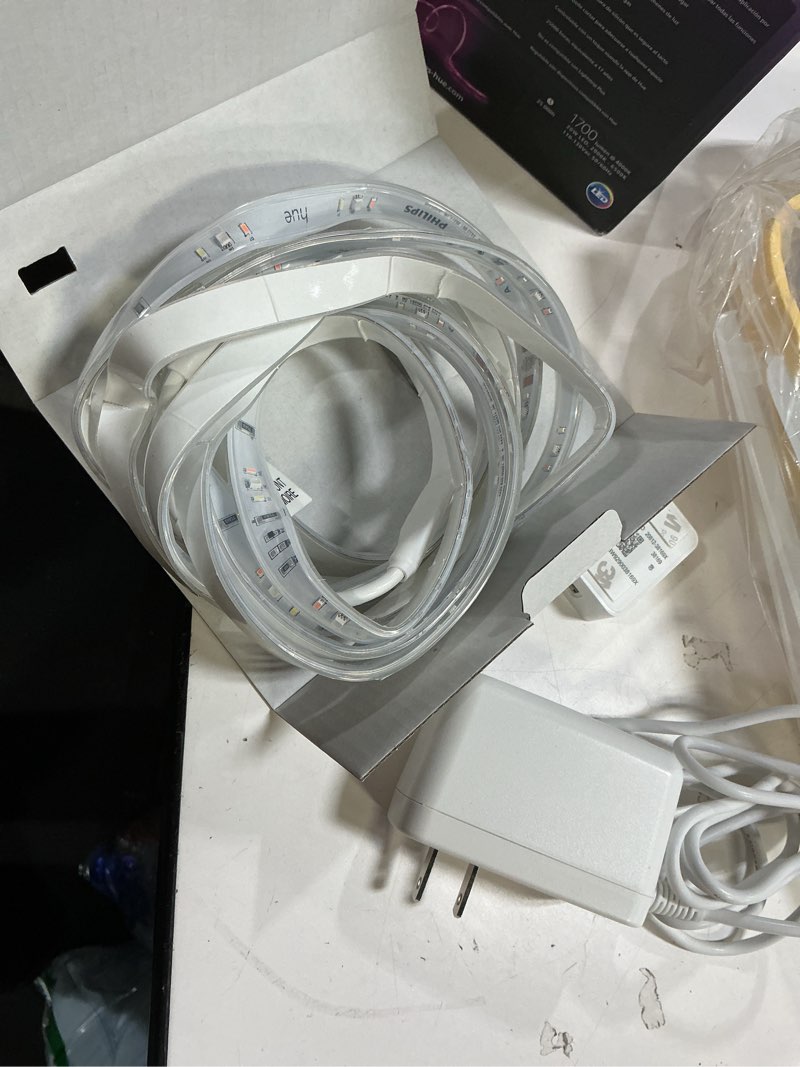 Condition photo showing As Is for philips hue indoor 10 ft smart rgbww led solo lightstrip base kit, 1 pack, control with hue app, led strip lights compatible with alexa, google assistant and apple homekit