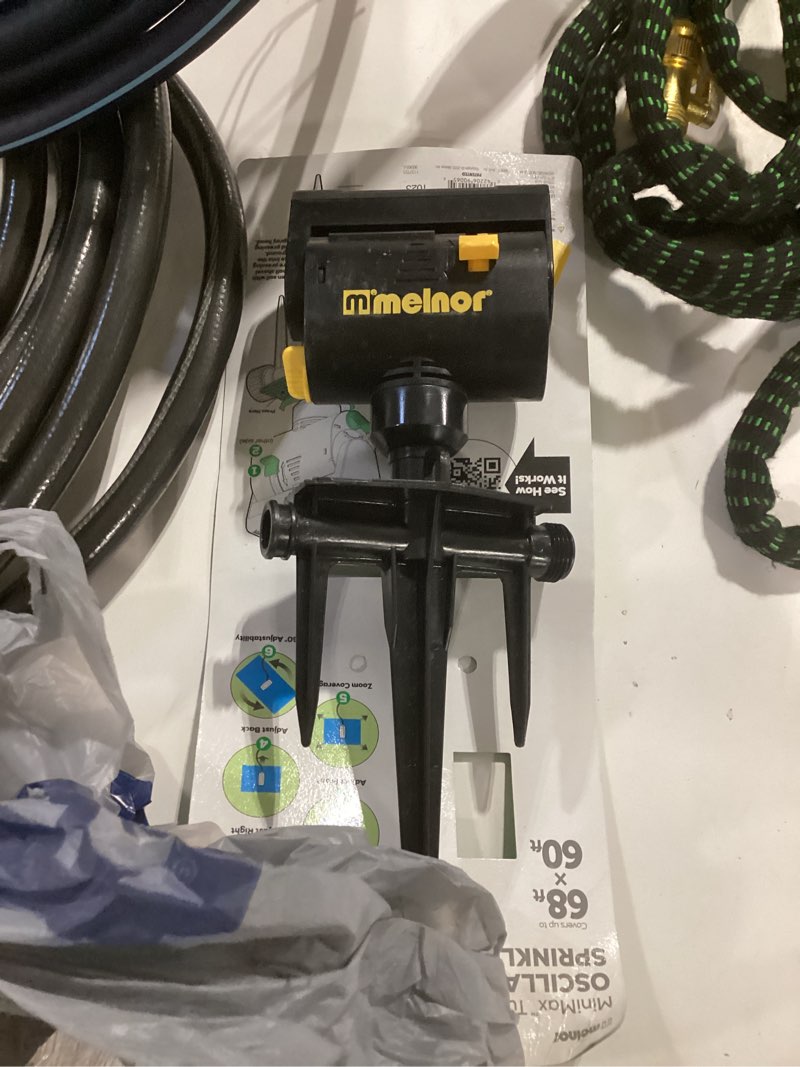 Condition photo showing Good Condition for melnor minimax 4000-sq ft oscillating spike lawn sprinkler