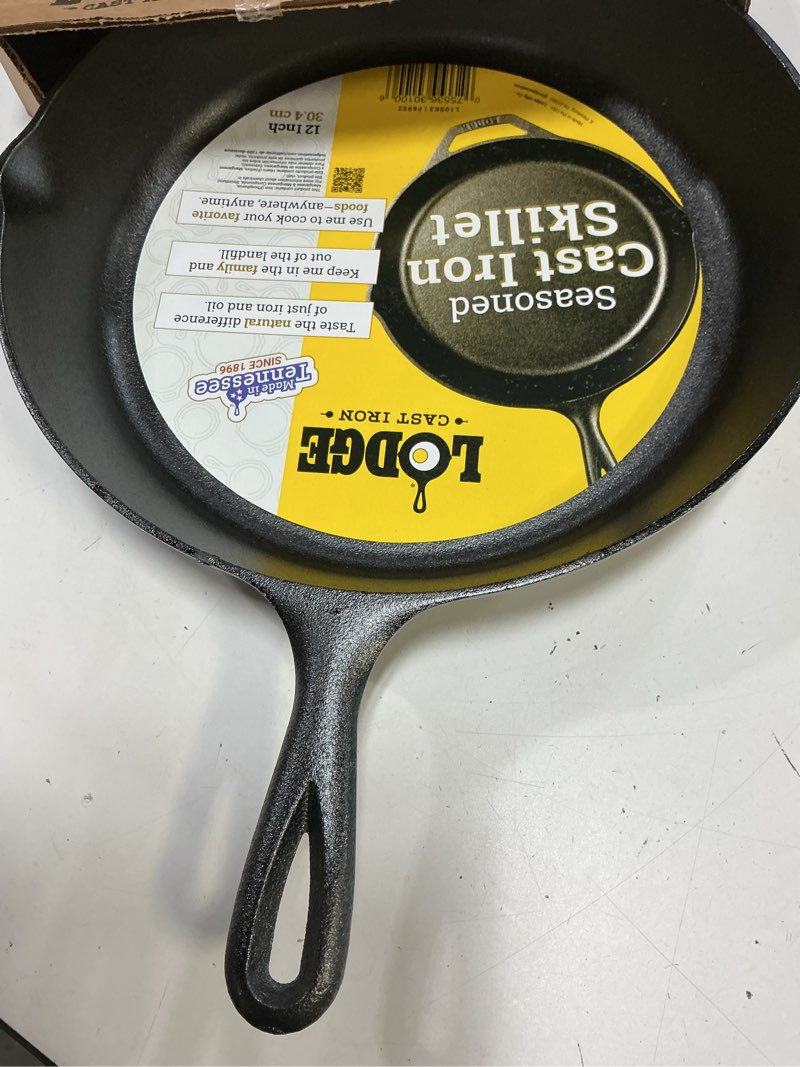 Condition photo showing New/Like New for lodge 12 inch cast iron pre-seasoned skillet – signature teardrop handle - use in the oven, on the stove, on the grill, or over a campfire - black 12 inch (1 count)