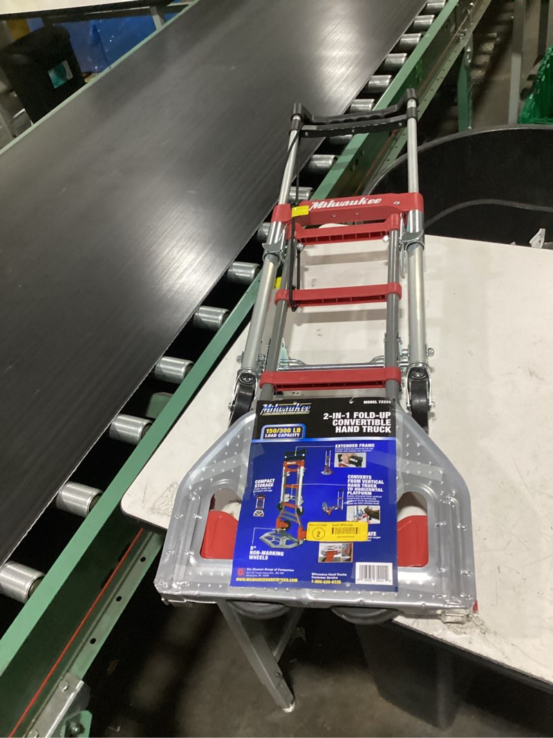 Condition photo showing As Is for milwaukee hand trucks 73333 fold-up convertible hand truck, 4-piece frame, compact storage, 300 lb capacity, red