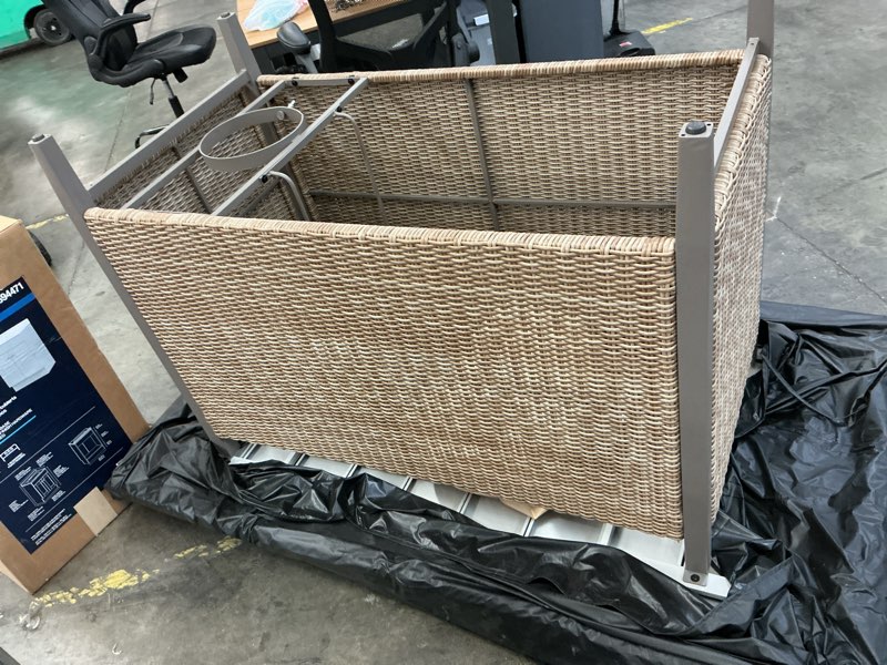 Condition photo showing As Is for beige outdoor woven firepit table 