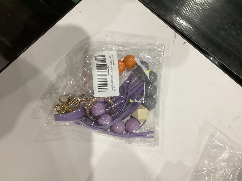 Condition photo showing New/Like New for keychain wristlet Silicone Key Ring Bracelet Car Keys Holder Women Beaded Bangle Chains with Leather Tassel Purple