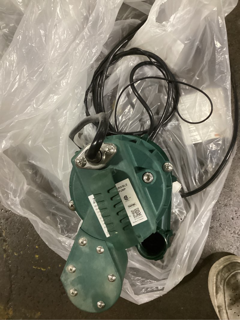 Condition photo showing As Is for (possibly used)zoeller 1/2-hp 115 -volt 60-gallon cast iron submersible sump pump