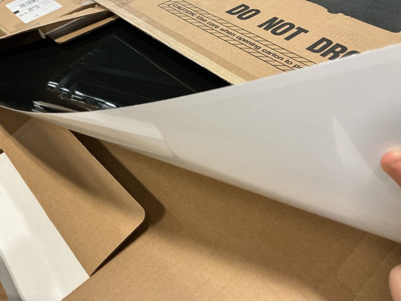 Condition photo showing As Is for broan-nutone, sp300224, reversible backsplash splatter guard and cooking shield, range hood accessories to keep kitchen clean, 30" x 24", black and white, 1 24 by 30 inch white/black