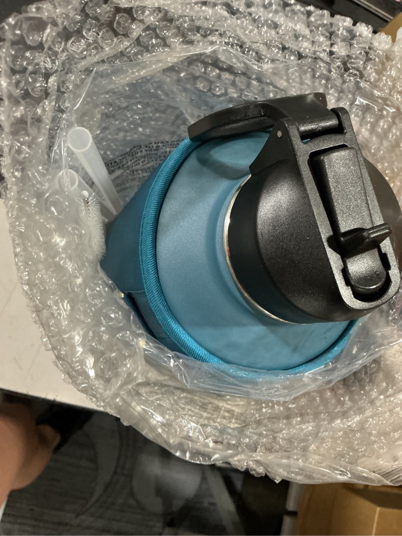 Condition photo showing Good Condition for half gallon water bottle insulated with straw & 3 lids, coolflask 64 oz water jug large metal stainless steel wide mouth for sports, gym or office, non-bpa keep cold 48h hot 24h, samurai cyan samurai cyan 64 ounces