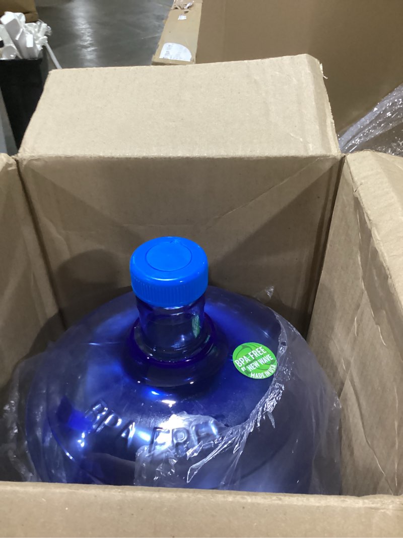 Condition photo showing As Is for new wave enviro bpa free pet bottle, 5-gallon capacity, screw top, designed for durability with integrated handle, blue color