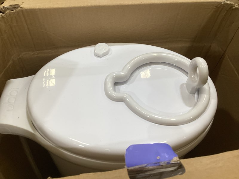 Condition photo showing As Is for ubbi diaper changing value gift set, includes white diaper pail, absorbing gels, travel changing mat, pail waste bags, on-the-go waste sacks & bag dispenser, & baby wipes, baby registry gift