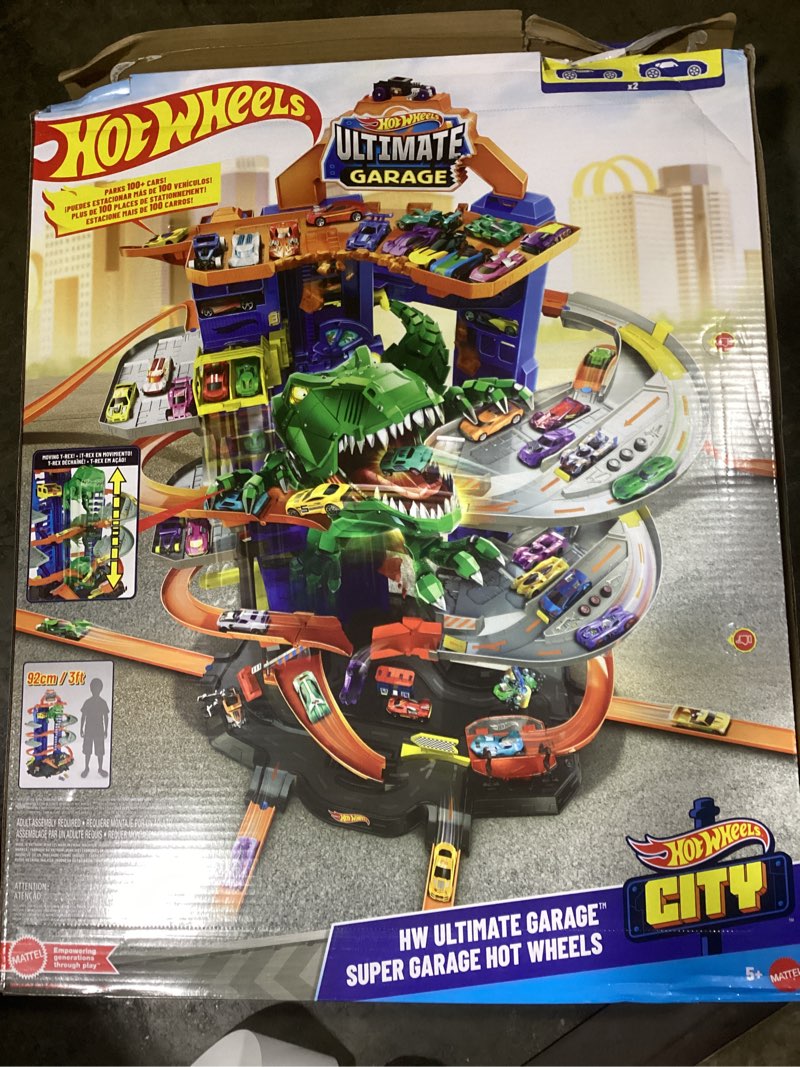 Condition photo showing Good Condition for Hot Wheels City Toy Car Track Set, Ultimate Garage with T-Rex Dinosaur, Store 100+ 1:64 Scale Vehicles, 3-ft Tall, with 2 Cars (Amazon Exclusive)