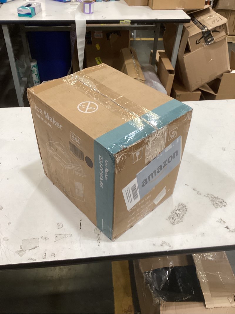 Condition photo showing As Is for this item is a zbj-pp10a-bk portable ice maker in black, commonly known as a countertop ice maker.  