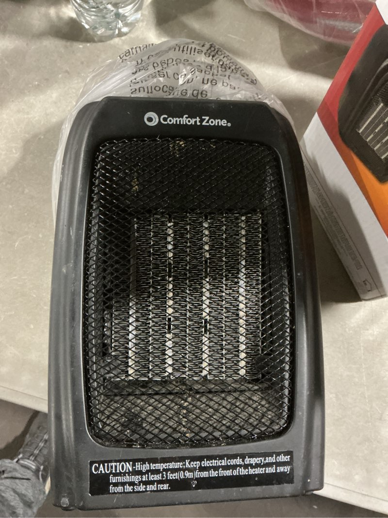 Condition photo showing As Is for comfort zone cz442e personal energy save ceramic heater - 1500w portable with adjustable thermostat, tip-over switch & overheat protection, black