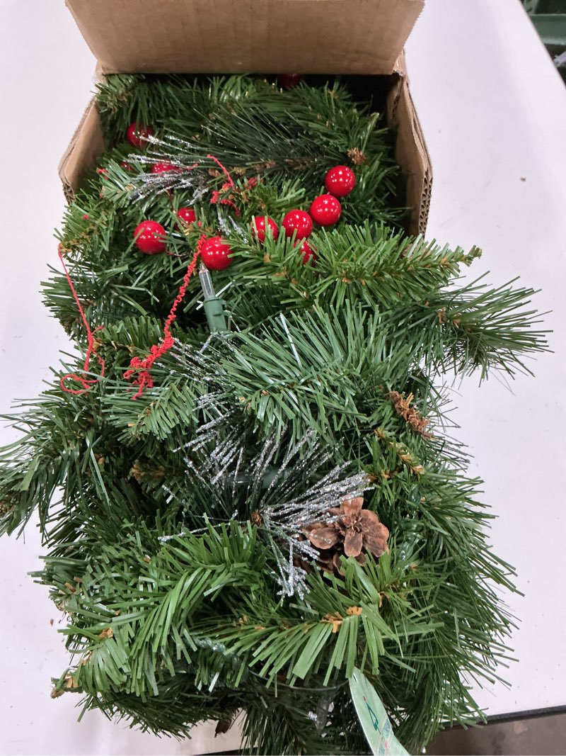 Condition photo showing Good Condition for National Tree Company 9 ft Pre-Lit Crestwood Spruce Artificial Christmas Garland, Christmas Decoration with Glitter, Pinecones, Red Berries, 50 Clear Lights, 180 Tips, Green Plug In Tree