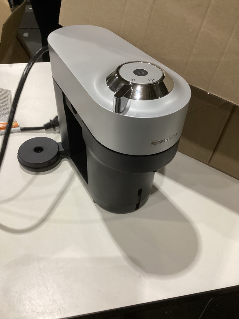 Condition photo showing As Is for nespresso vertuo pop+ deluxe coffee and espresso maker by breville with milk frother, matte black gold machine + milk frother matte black gold, not tested