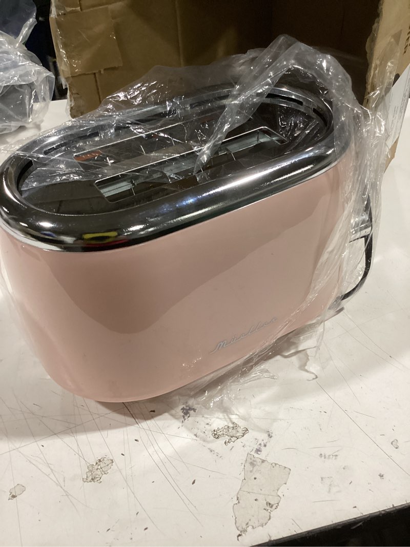 Condition photo showing As Is for mueller home retro toaster 2 slice, 7 browning levels, 3 functions (reheat, defrost, cancel), stainless steel features, removable crumb tray, under base cord storage, pink kitchen accessories décor 2 slice pink