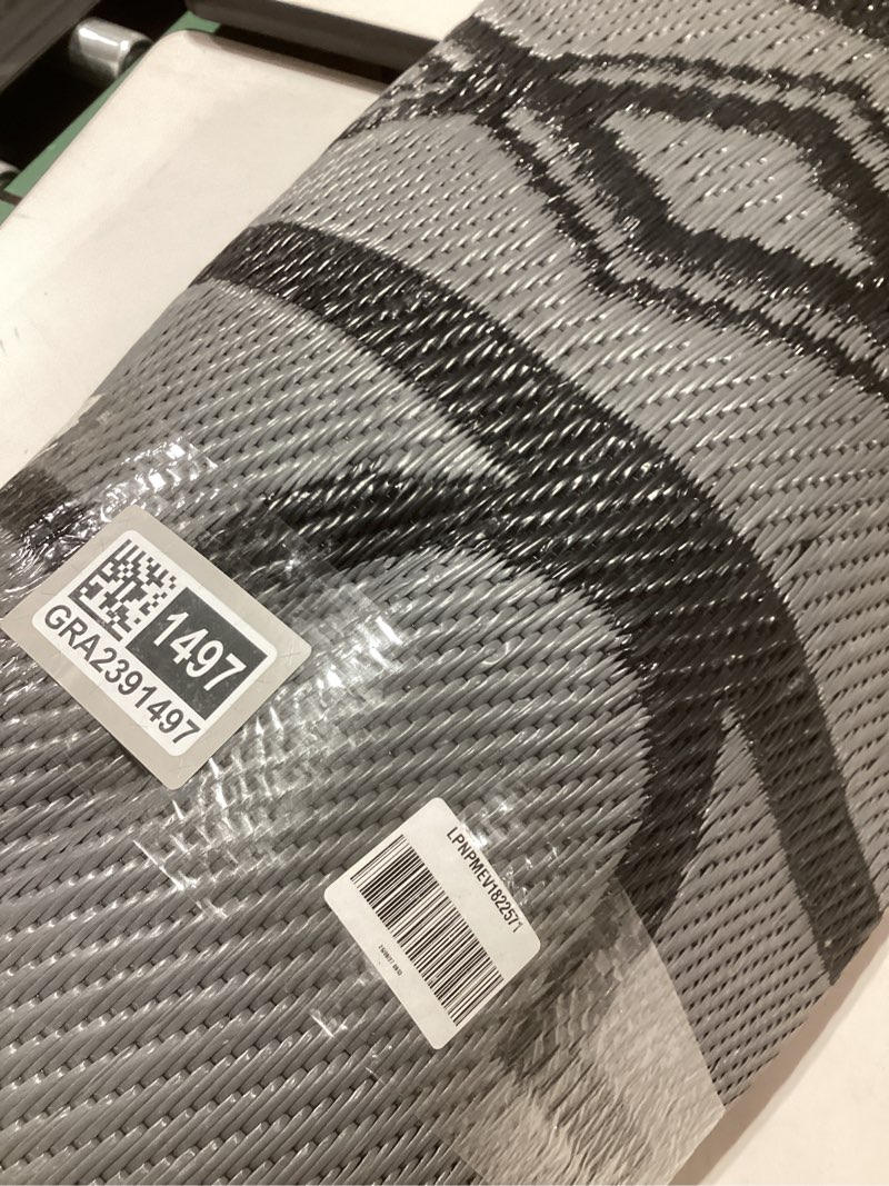 Condition photo showing New/Like New for Garvee Outdoor Rug for Patio Clearance, 10 ft x14 ft Waterproof Large Camping Mat, Reversible Plastic Straw Rugs for RV, Camper, Balcony, Backyard, Picnic, Deck (Black/Grey) Black/Grey 10*14ft