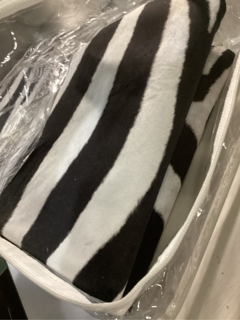 Condition photo showing Good Condition for Funky Zebra Print Area Rug? 5.2x6.2 FT Faux Cowhide Rug Non-Slip, No-Fur Durable Carpet for Living Room Bedroom, Pet-Friendly Nursery Kids Rug with Authentic Pattern Black White 5'2" x 6'2" (Oval)