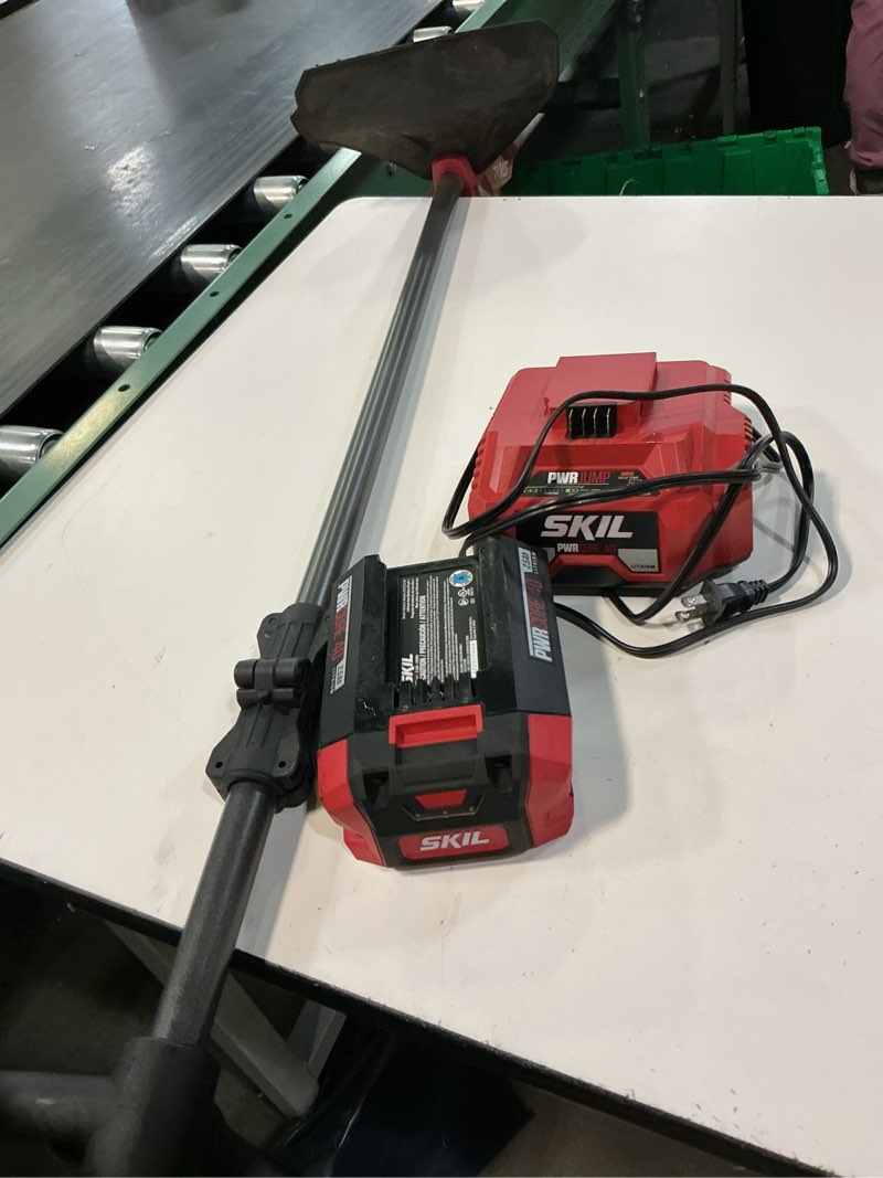 Condition photo showing As Is for skil pwr core 40 with smartload 40-volt 15-in straight shaft battery string trimmer 2.5 ah (battery included) (charger included)