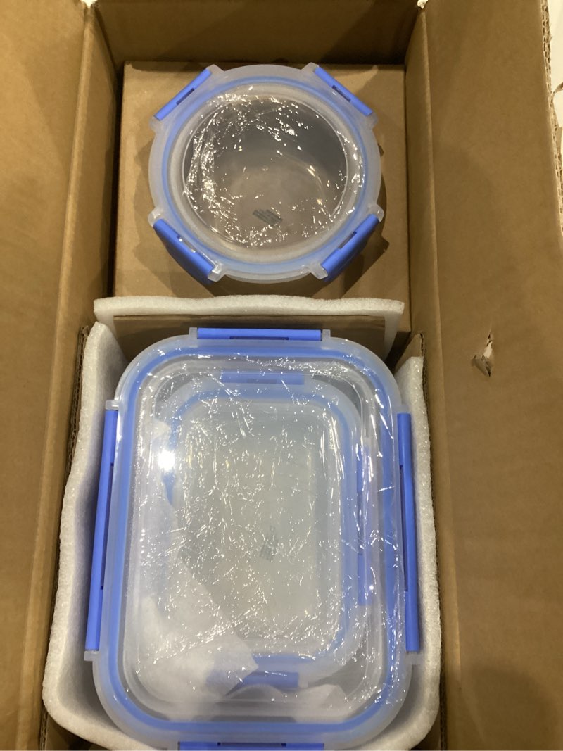 Condition photo showing As Is for Amazon Basics Glass Food Storage Containers with Locking Lids, Set of 7, 14 pieces including lids, BPA-Free, clear with blue silicone ring 14-Piece Set