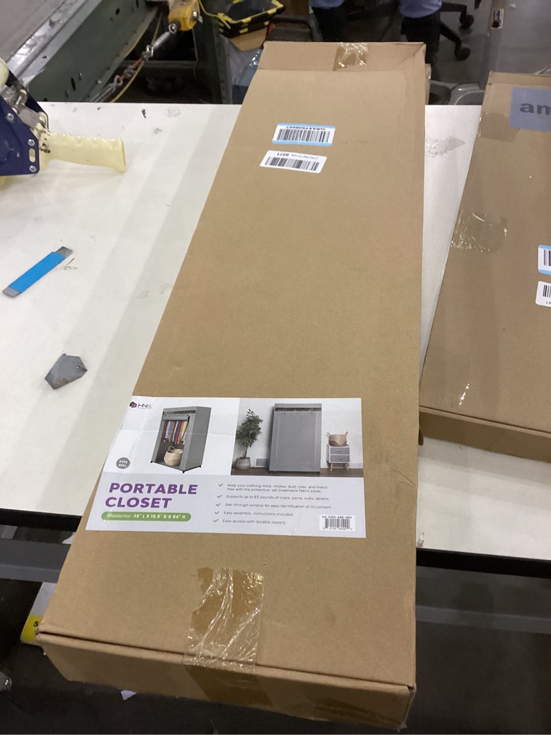 Condition photo showing As Is for HOLDN’ STORAGE Portable Wardrobe Closet - 50 lb Capacity, Internal Heavy Duty Metal Rod, Zipper & Clear Window, Durable Clothes Organizer, Tool-Free Easy Assembly, Dark Gray Canvas Cover Medium Dark Gray