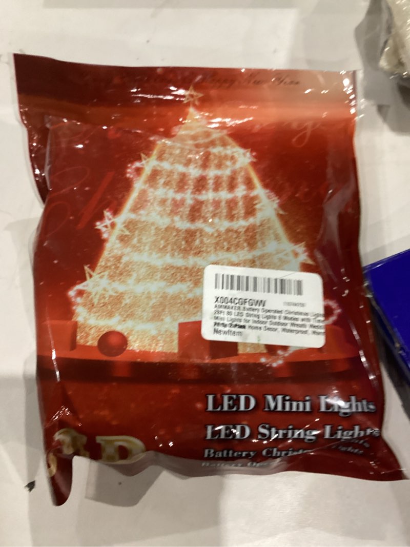 Condition photo showing item condition for Battery Operated Christmas Lights, 28Ft 80 LED String Lights 8 Modes with Timer Mini Lights for Indoor Outdoor Wreath Wedding Party Garden Home Decor, Waterproof, Warm White?2 Pack? 80LED 2pack