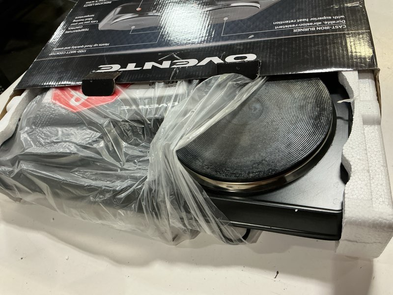 Condition photo showing As Is for ovente electric countertop double burner, 1700w cooktop with 7.25" and 6.10" cast iron hot plates, temperature control, portable cooking stove and easy to clean stainless steel base, black bgs102b bgs102b - black