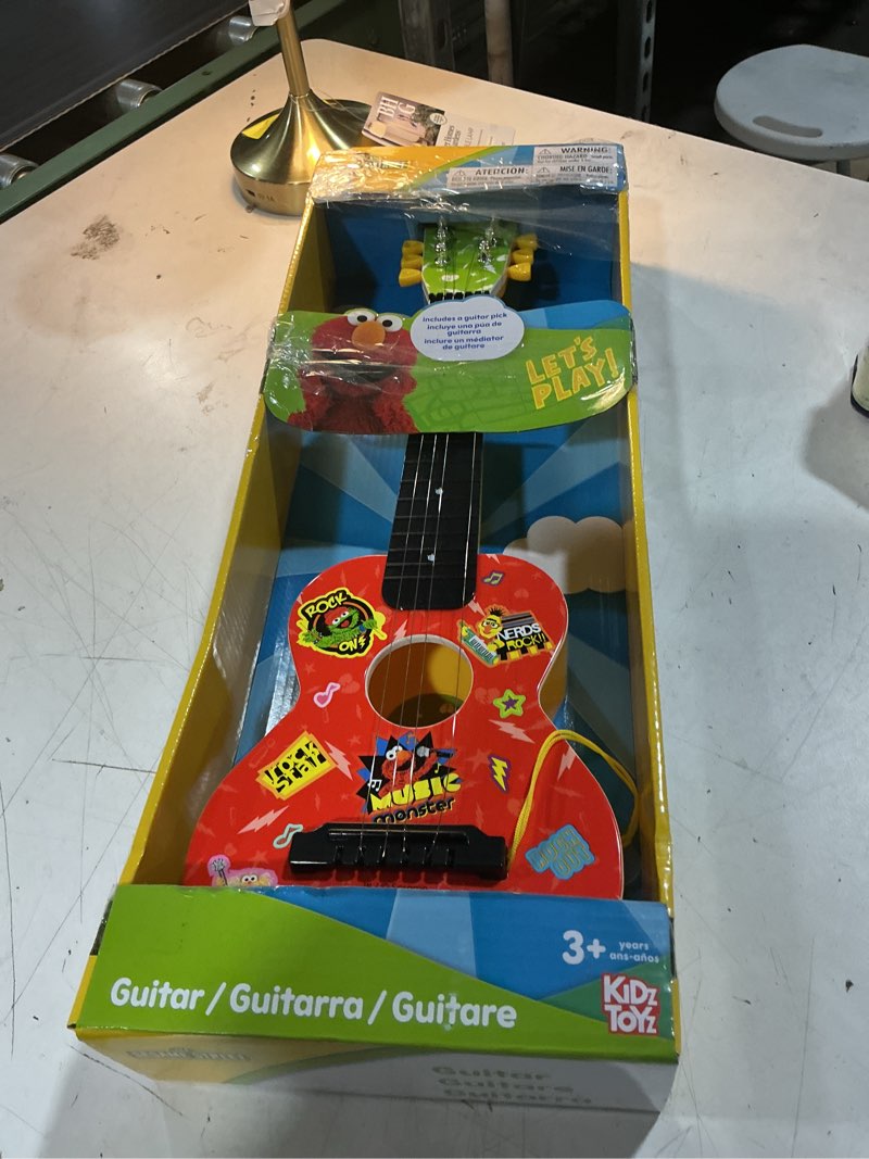 Condition photo showing As Is for elmo sesame street ukulele by first act - ss285