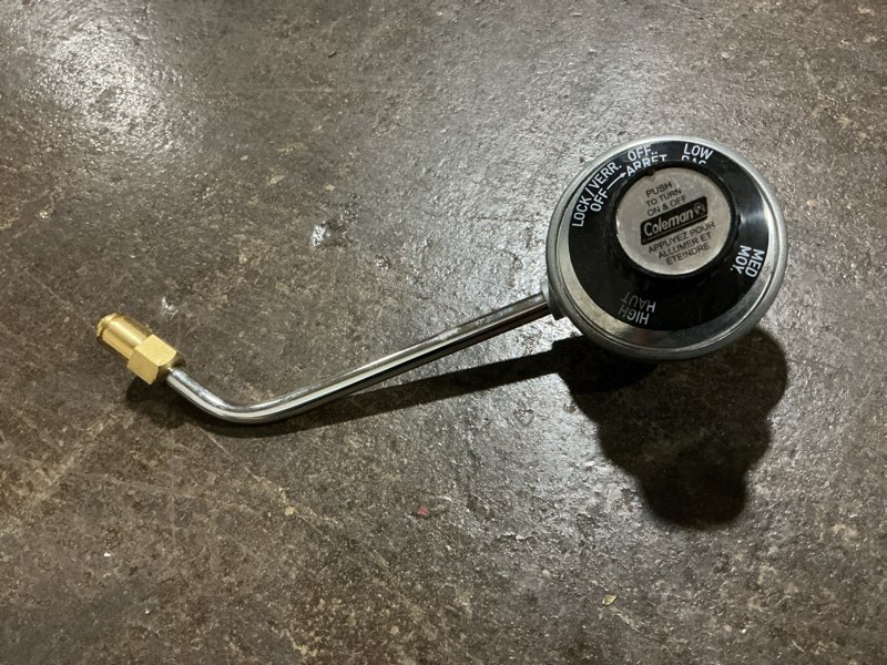 Condition photo showing As Is for 9924-5251 Regulator Assembly Global Model 666 for Coleman 9924 Series Portable Grill