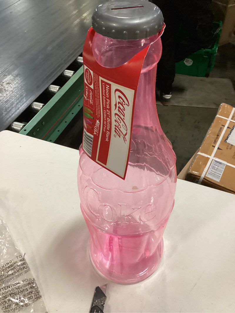 Condition photo showing New/Like New for coca-cola 22\" clear bottle bank - pink